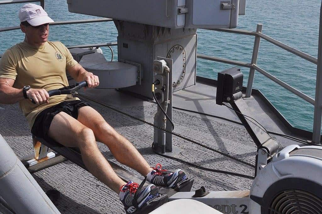 a man using a rowing machine at the ship